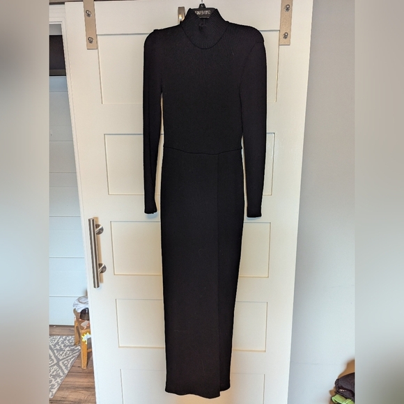 Black long sleeve knit turtle neck dress with zipper back and front slit. - Picture 1 of 5